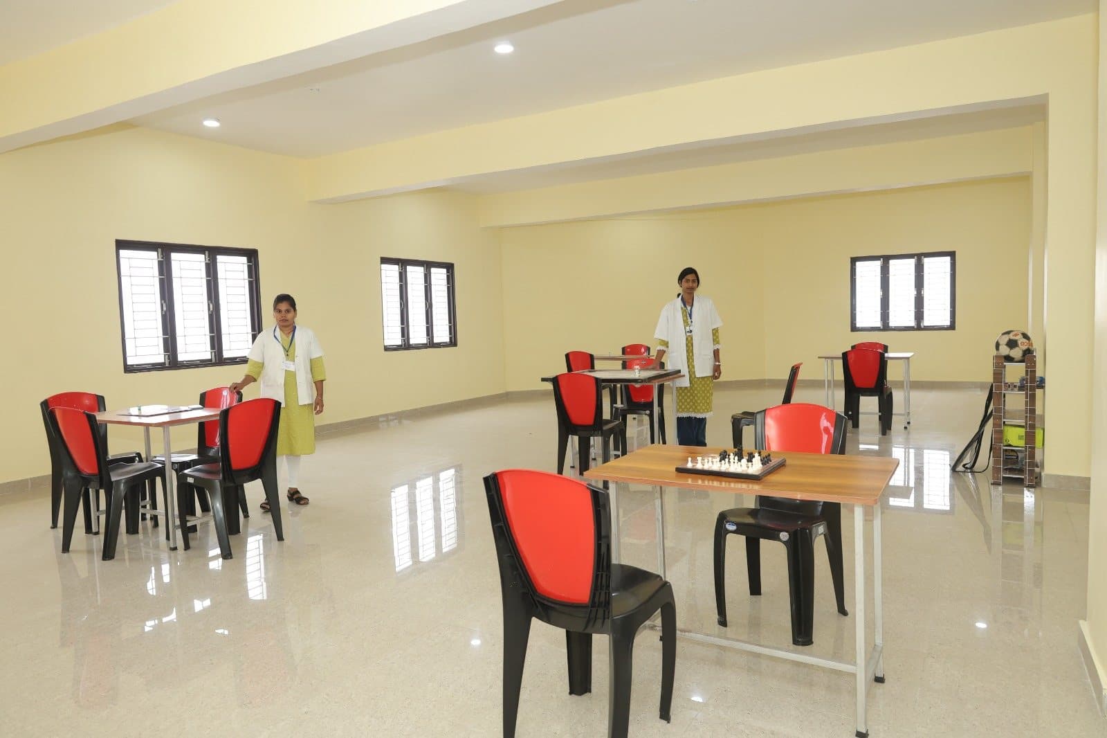 Indoor games room with chess and sports equipment for students