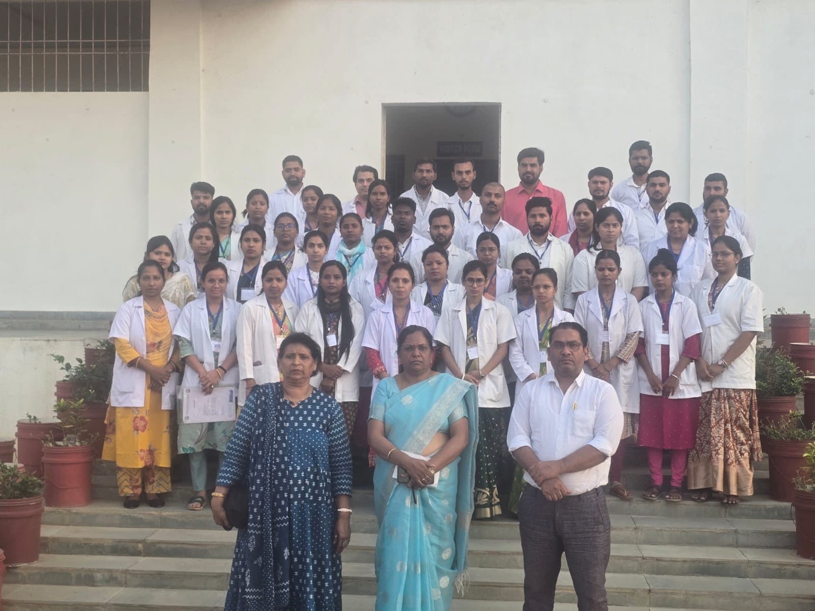 Faculty and students of the institute assembled at the main entrance